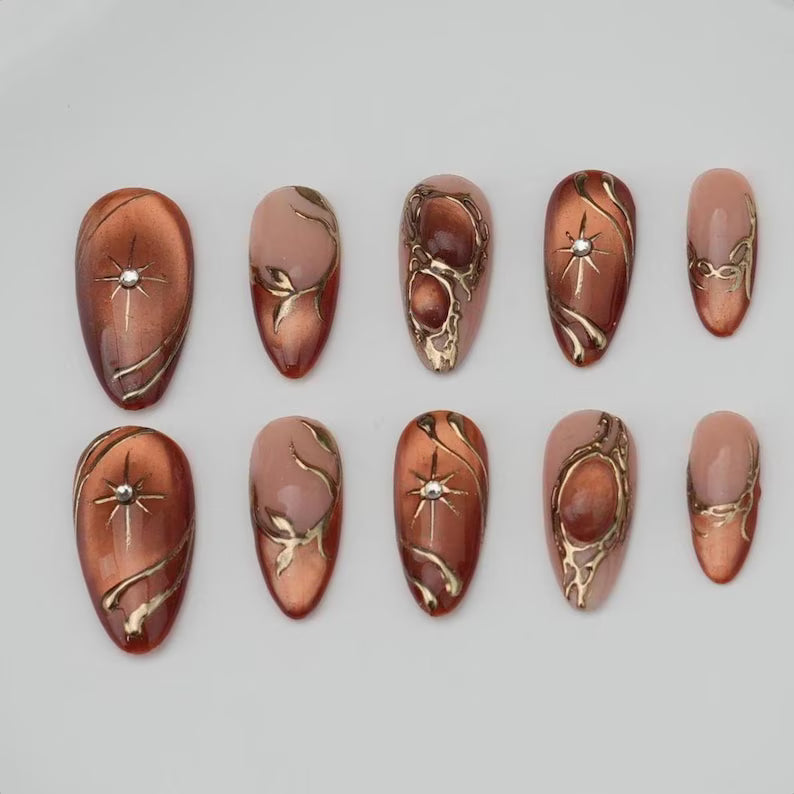 Luxury Bronze Nude Press On Nails with Gold Chrome Lines and Star Details | Elegant Long Almond Nails for Special Occasions