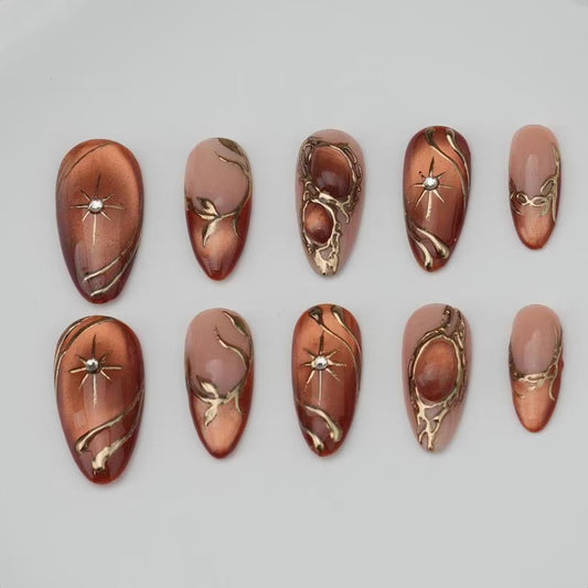 Luxury Bronze Nude Press On Nails with Gold Chrome Lines and Star Details | Elegant Long Almond Nails for Special Occasions