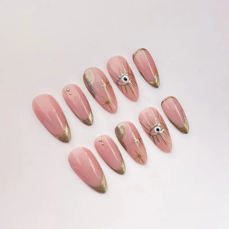 Pink Gold Evil Eye Almond French Tip Nails | Hand Painted Star & Eye Protective Nail Design