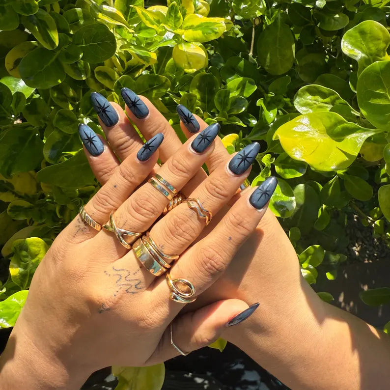 Unique Midnight Blue Starburst Nails | Press-On Stiletto Nails with Bold Black Stars