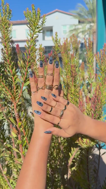 Unique Midnight Blue Starburst Nails | Press-On Stiletto Nails with Bold Black Stars